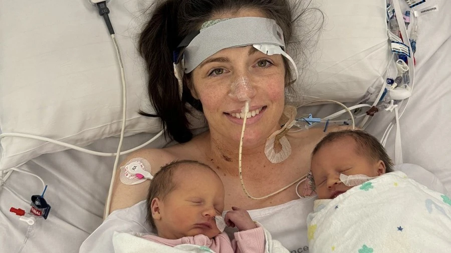 Alex Judd with twins