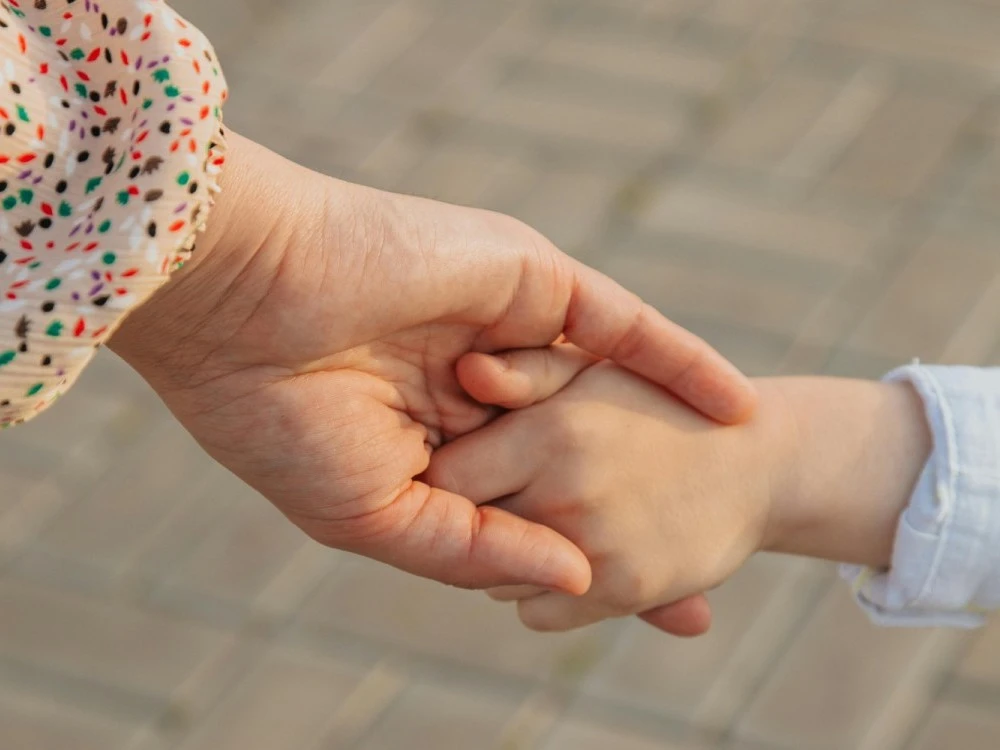 childs-hand-holding-hand-of-adult.jpg