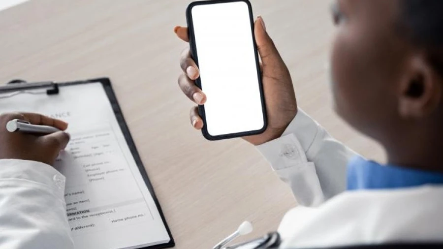 Doctor with phone and checklist
