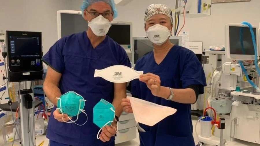 Dr Daryl Williams and Dr Irene Ng with N95 face masks