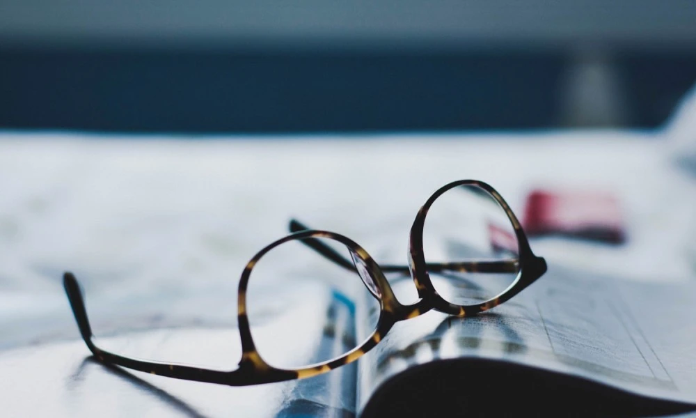 Glasses resting on an open book