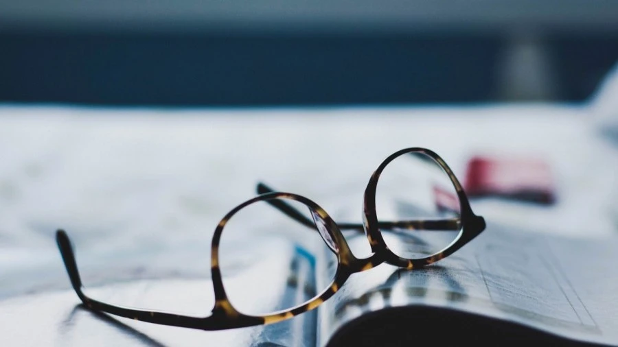 Glasses resting on an open book