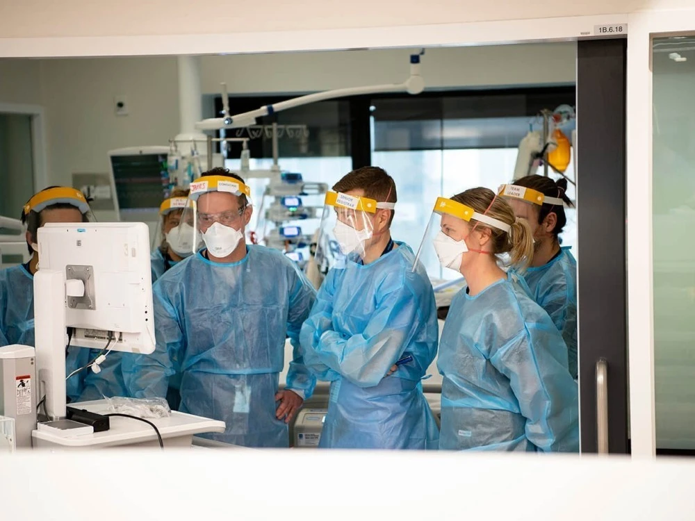 Staff in ICU looking at screen