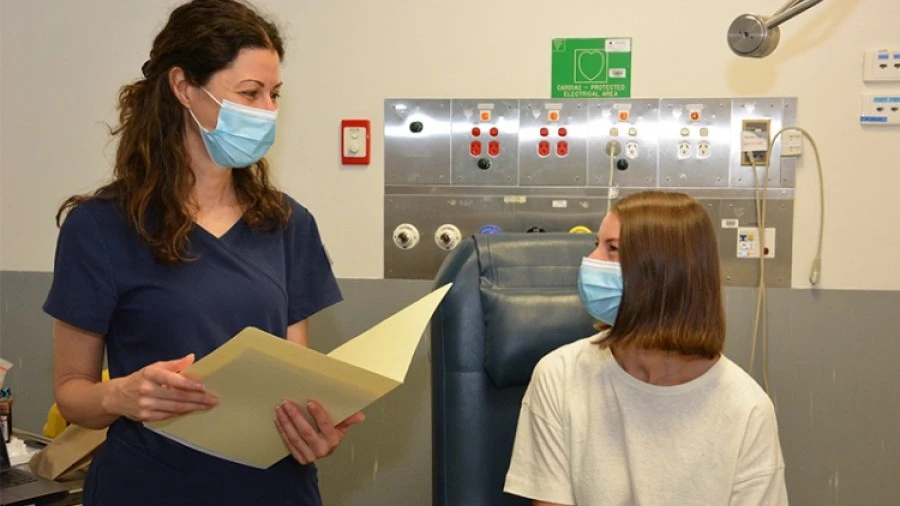 Lucy Lee in BANDIT clinical trial with staff member