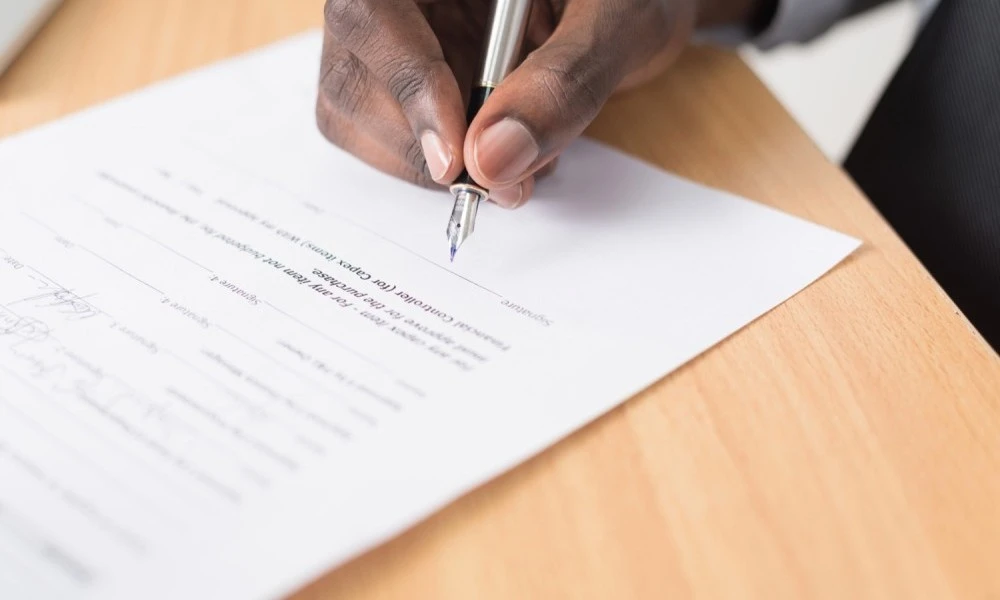 Man signing document
