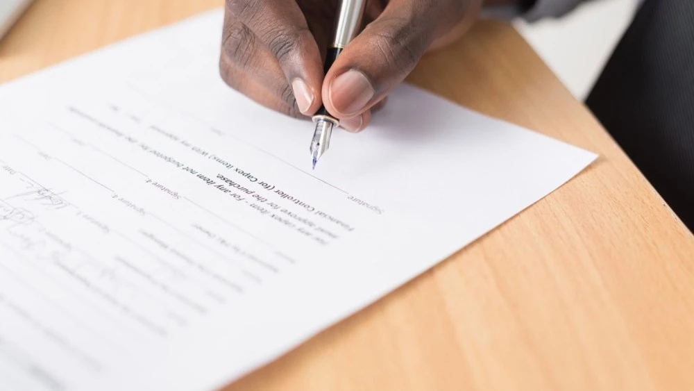 Man signing document