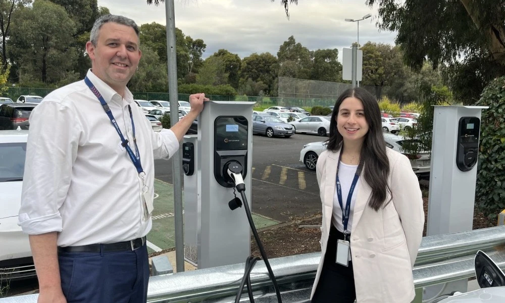 Nathanael Sneddon and Meagan Rhodes with EV stations