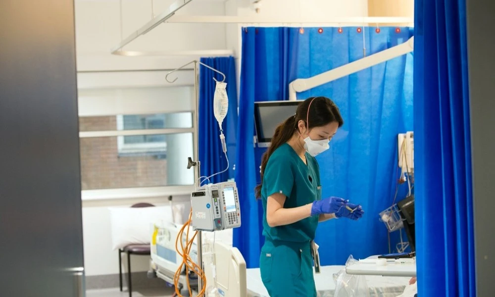 Nurse attending to patient on Ward 2B
