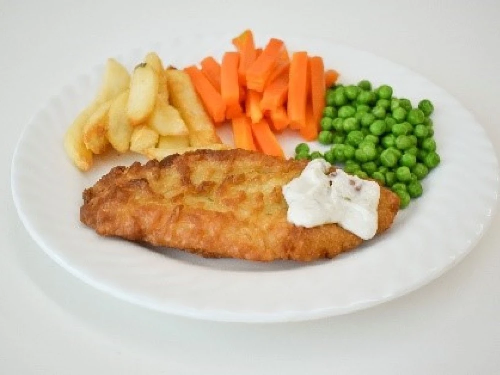 Example of patient meal of battered fish, chips and vegetables