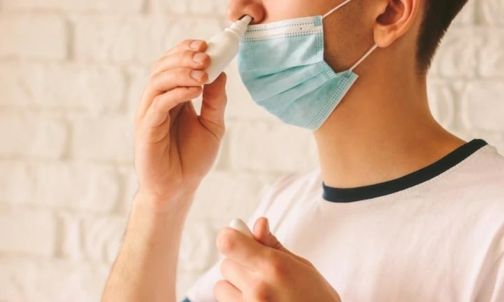 Person using nasal spray