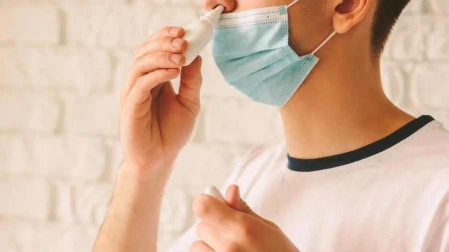 Person using nasal spray