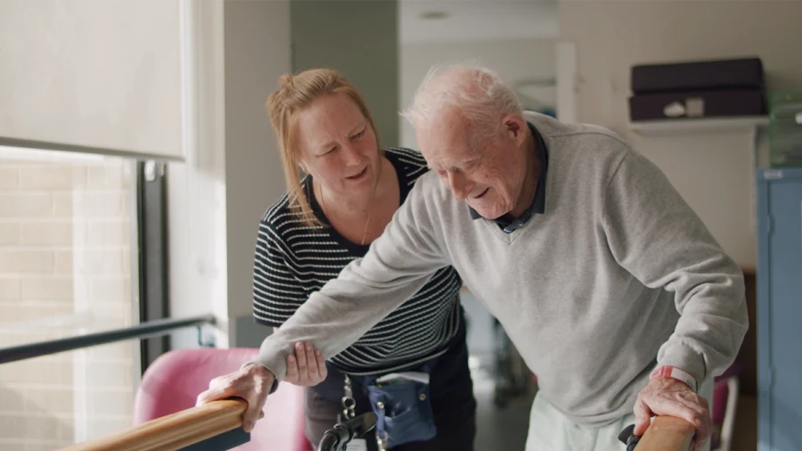 Physiotherapist supporting a patient