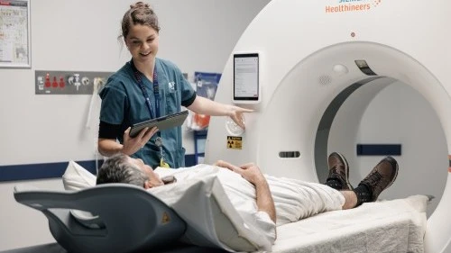 radiology-staff-member-provides-imaging-scan-to-patient.jpg