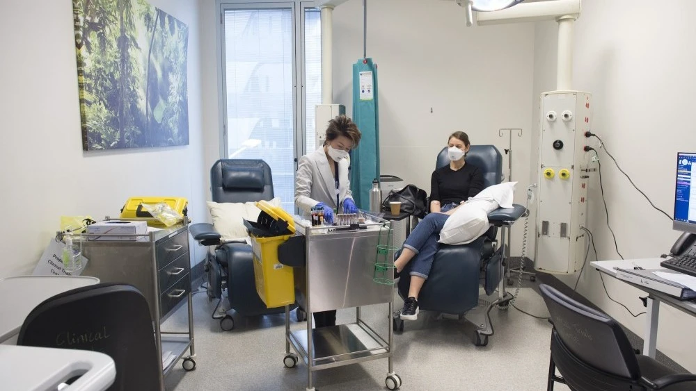 Diabetes and Endocrinology research nurse with patient in Clinical Trials Centre
