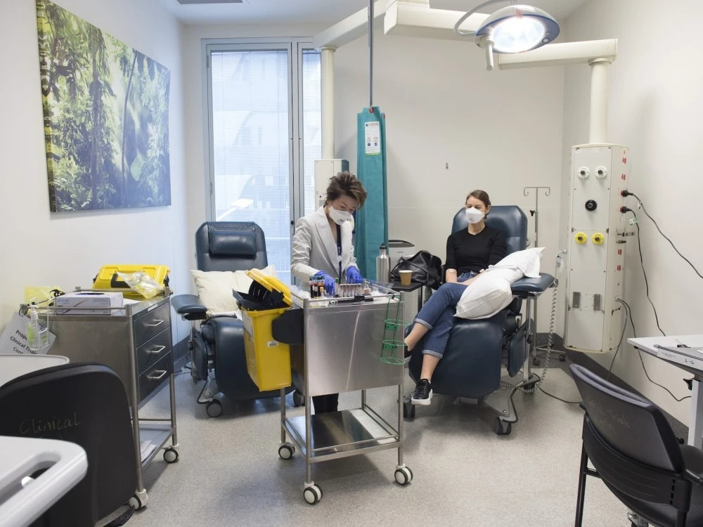 Diabetes and Endocrinology research nurse with patient in Clinical Trials Centre