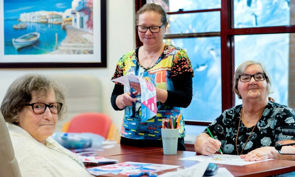 Residents and staff doing crafts at Boyne Russell House