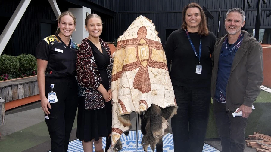 RMH staff with Possum Skin Cloak