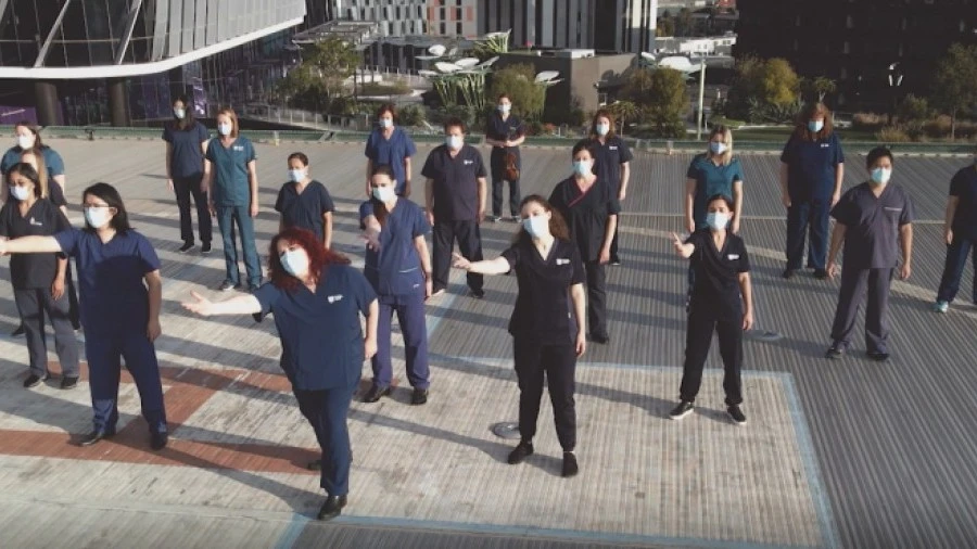 Scrub Choir perform on helipad