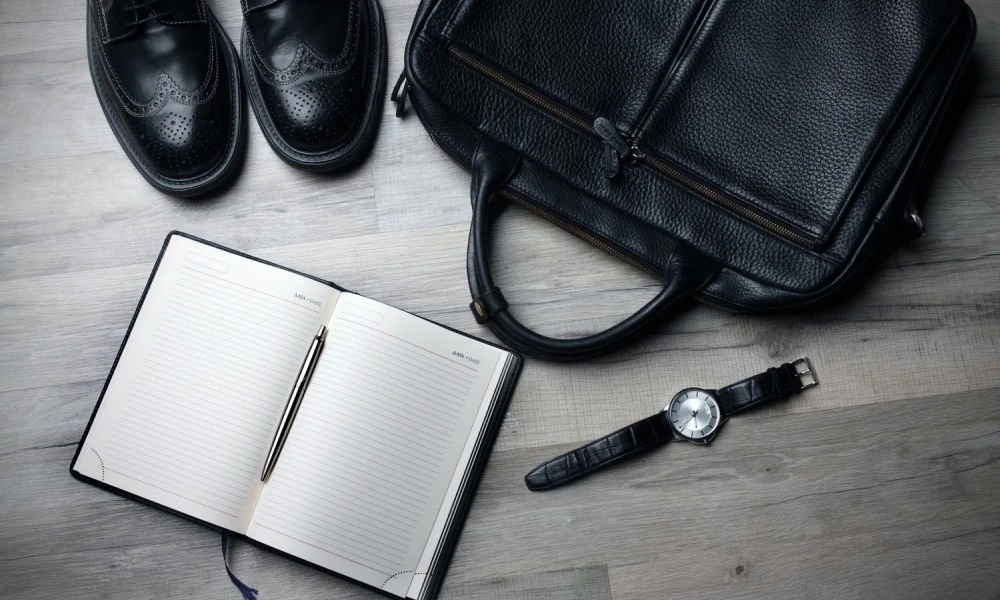 Collection of shoes, bag, notebook and watch
