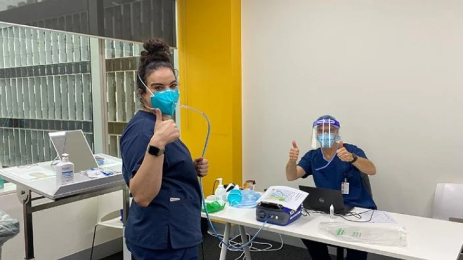 Staff give thumbs up during mask fit testing