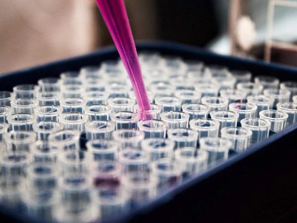 Dropping liquid into test tubes