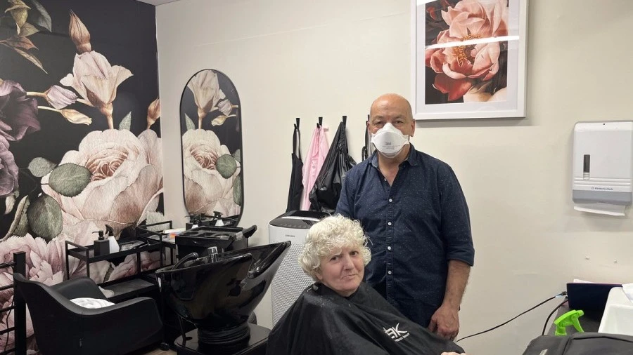Tony and client in Boyne Russell hair salon
