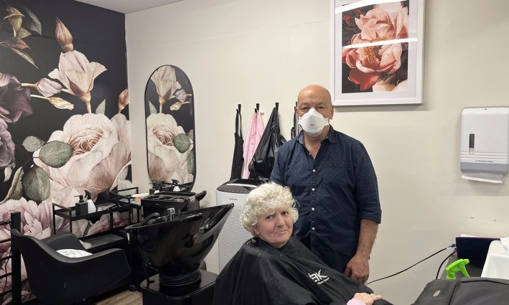 Tony and client in Boyne Russell hair salon