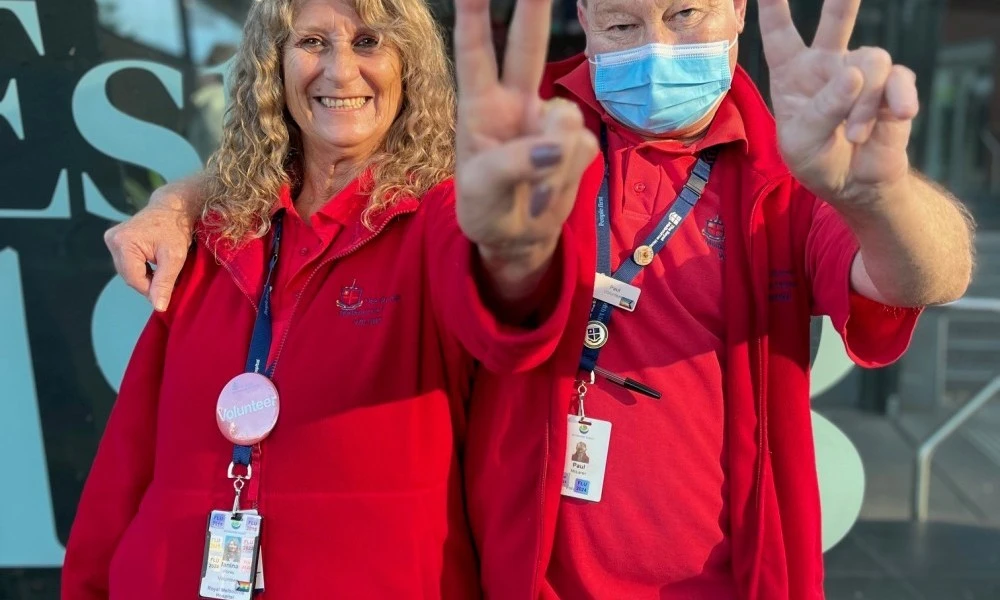 two-rmh-volunteers-giving-peace-sign.jpg