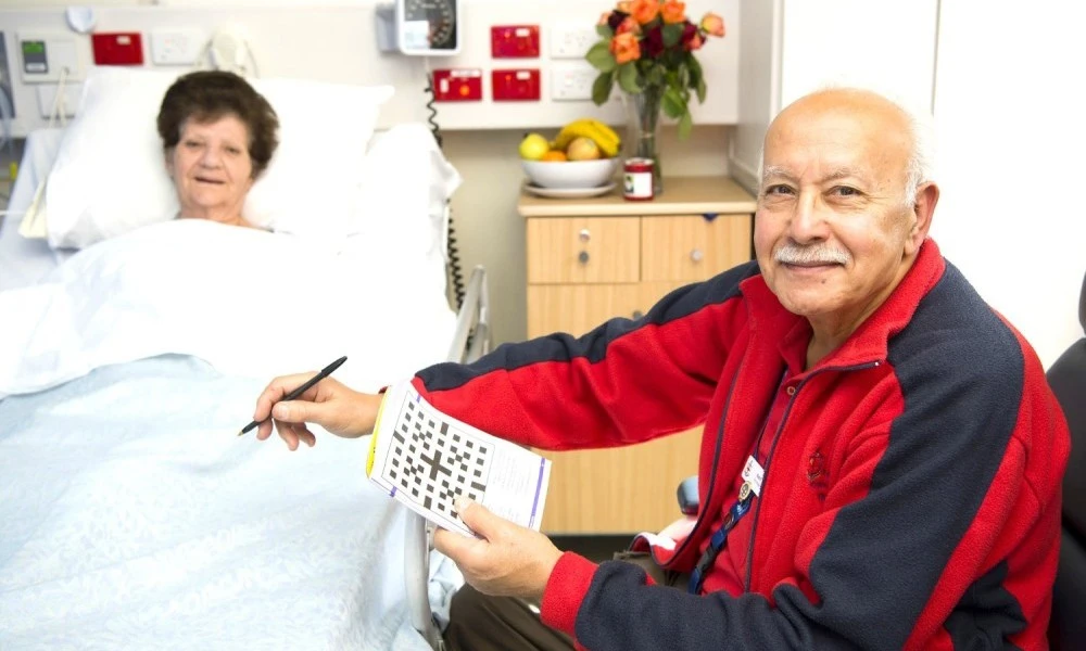 volunteer-doing-crossword-with-patient.jpg