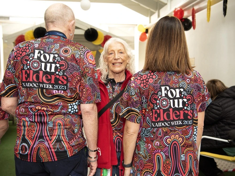 Volunteers in NAIDOC Week 2023 shirts (For Our Elders)