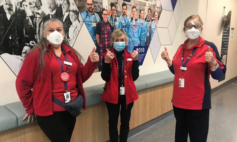 volunteers-wearing-masks-and-giving-thumbs-up.jpg