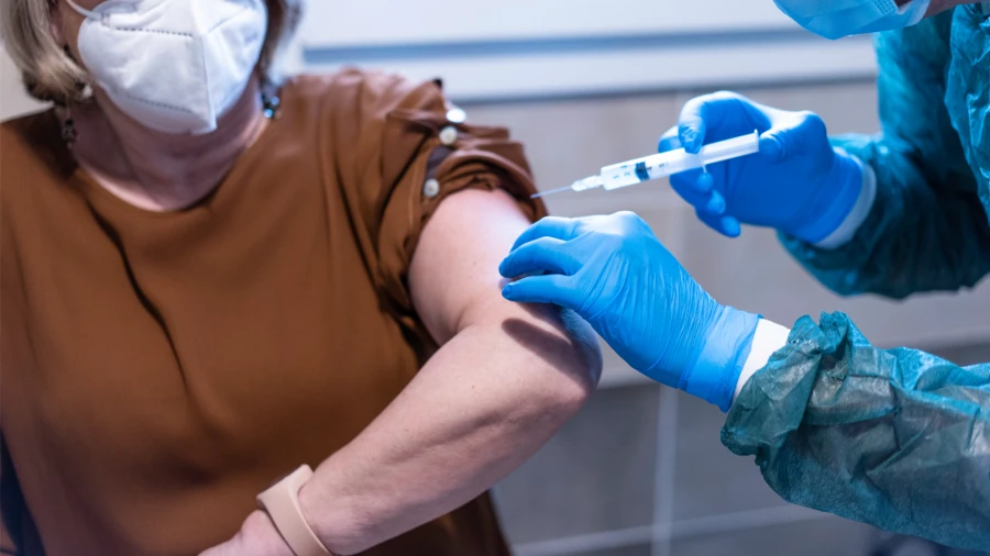Woman receiving vaccination