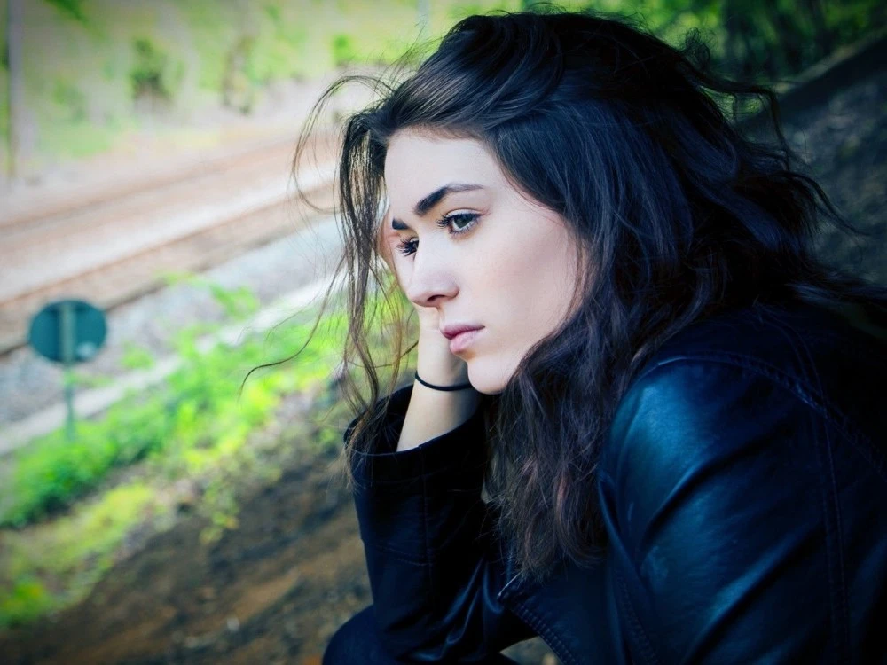 Young person looking sad