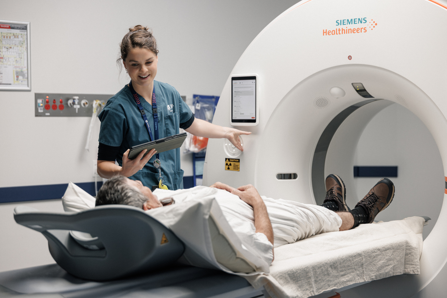 Radiology staff member providing patient scan