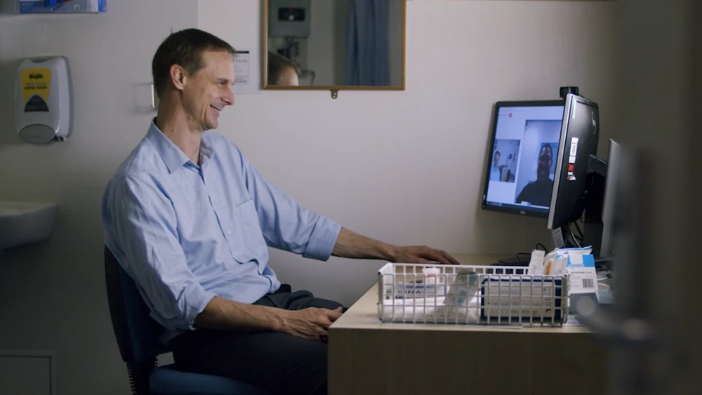 Person using Telehealth at home on desktop PC