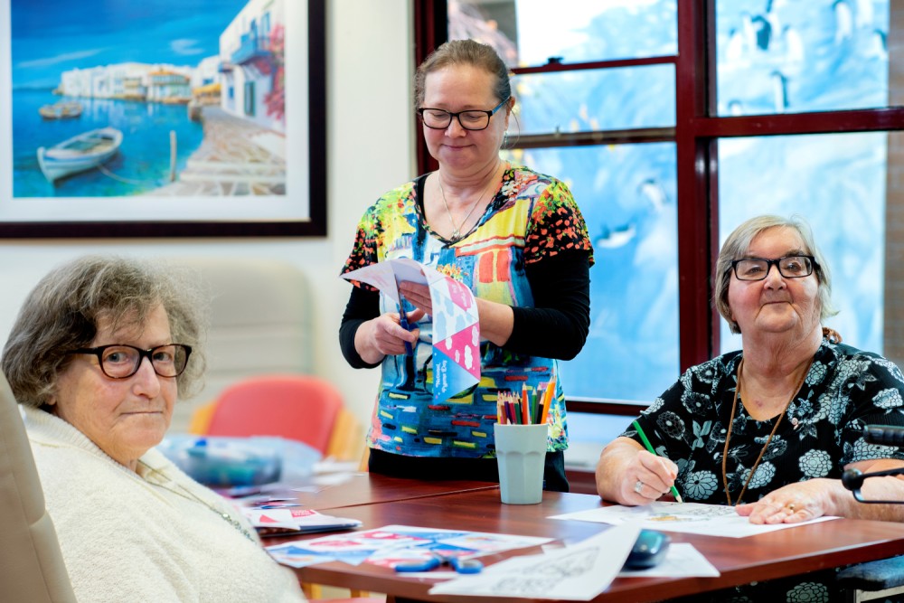 Residents and staff doing crafts at Boyne Russell House